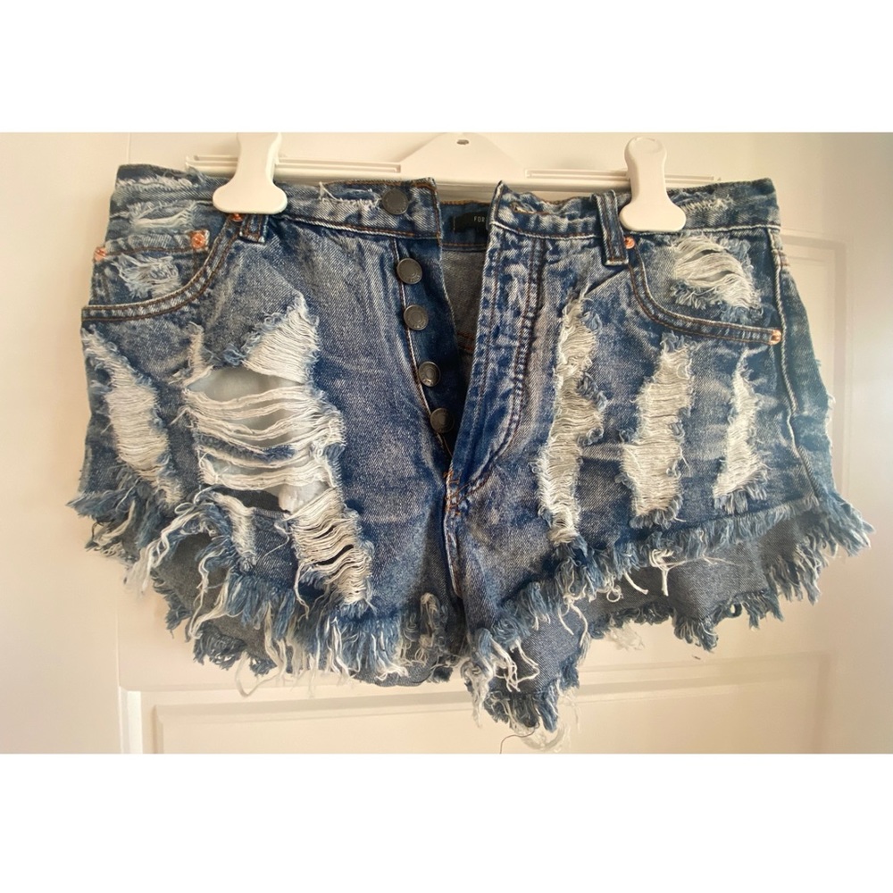 Distressed button-down blue denim shorts